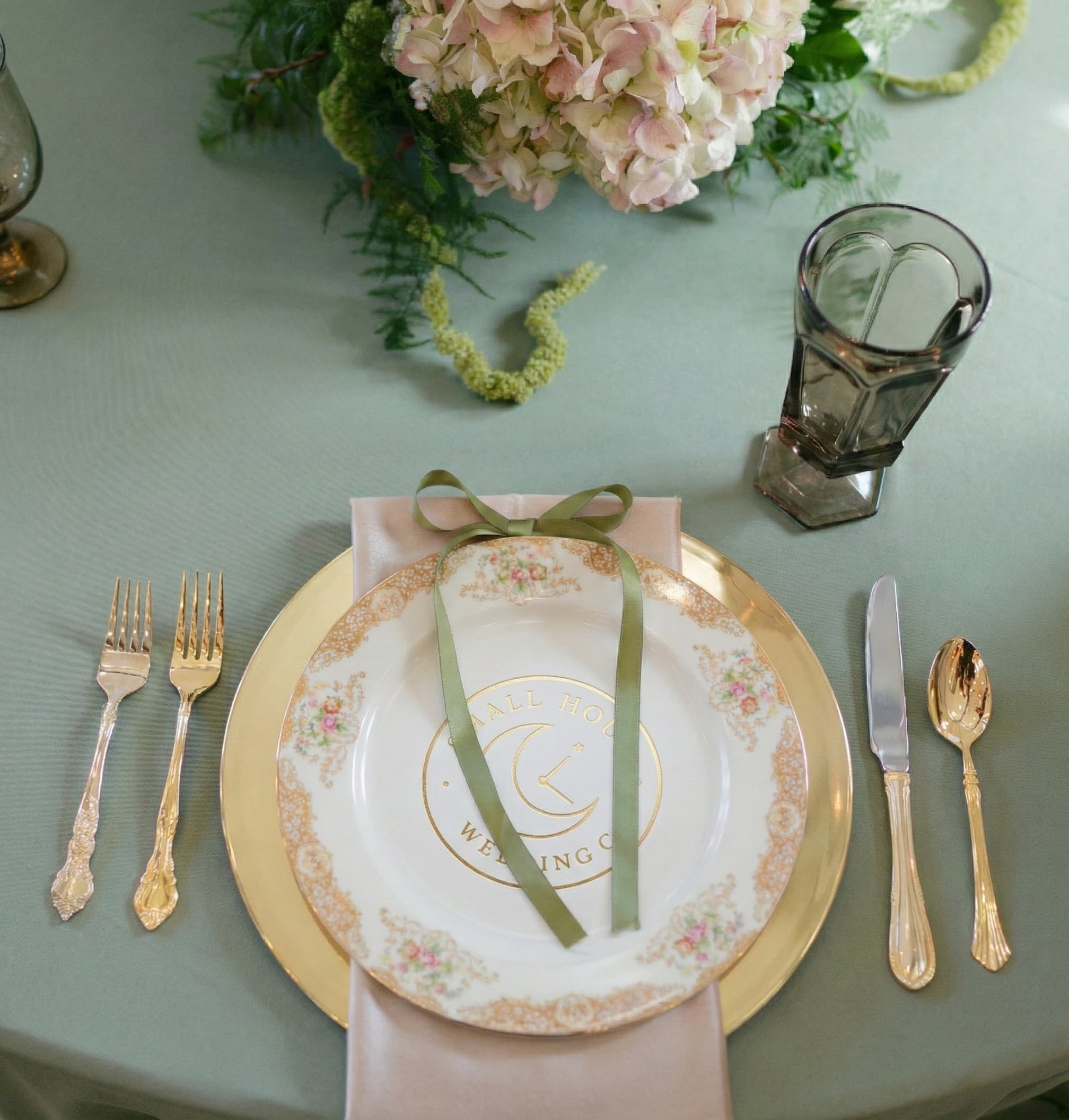 Intimate wedding details — vintage china and gold accents on styled table